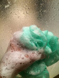 Cleaning a mirror with soapy water